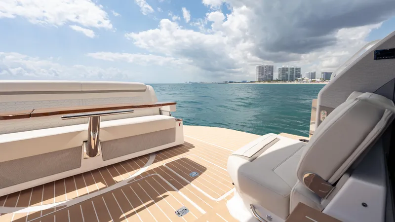 Slide: The Image of 2024 Tiara Yachts 48 LE deck with ocean view and modern seating. - 28
