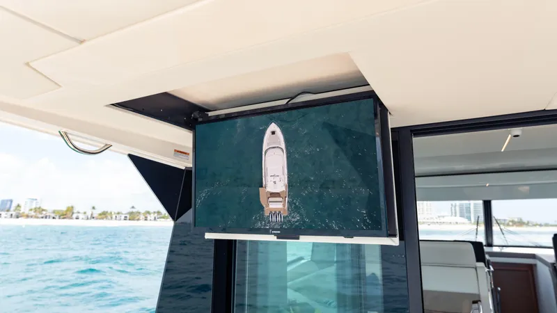 Slide: The Image of 2024 Tiara Yachts 48 LE displaying aerial view on onboard screen. - 33