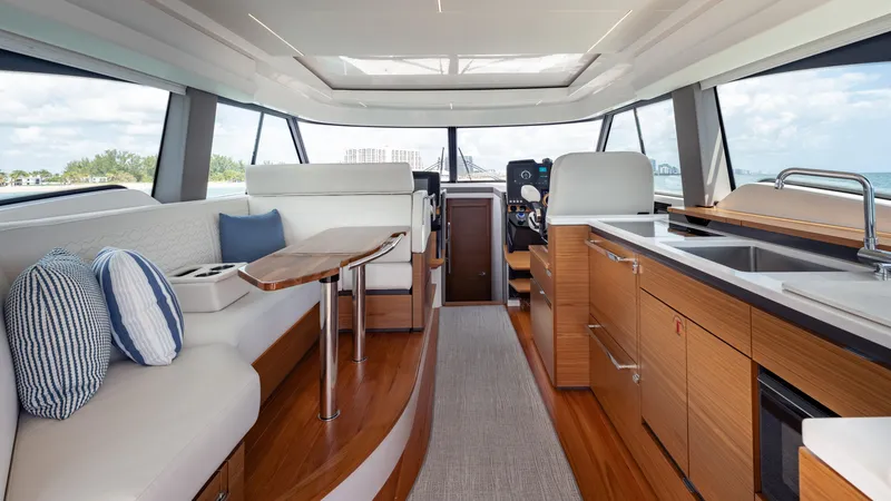Slide: The Image of Luxurious interior of 2024 Tiara Yachts 48 LE, featuring modern seating and kitchen area. - 35
