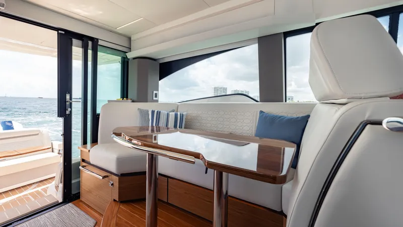 Slide: The Image of Luxurious interior of 2024 Tiara Yachts 48 LE with elegant seating and ocean view. - 38
