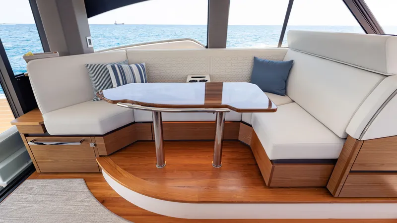 Slide: The Image of Luxurious interior of 2024 Tiara Yachts 48 LE with elegant seating and ocean view. - 39