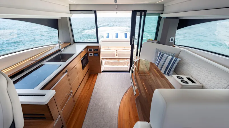 Slide: The Image of Luxurious interior of 2024 Tiara Yachts 48 LE with modern kitchen and seating area. - 40
