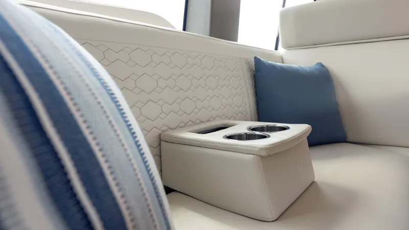 Slide: The Image of Luxurious seating with cup holders on 2024 Tiara Yachts 48 LE, featuring elegant cushions. - 42