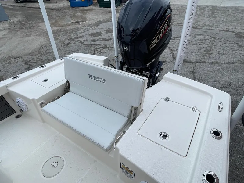 Slide: The Image of 2024 Pathfinder 2200 TRS boat with Yamaha engine, featuring white seating and storage compartments. - 7