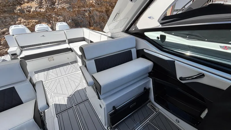 Slide: The Image of 2023 Monterey 385SS boat interior with sleek seating and modern design. - 12