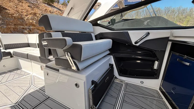 Slide: The Image of 2023 Monterey 385SS boat interior with modern seating and sleek design. - 13