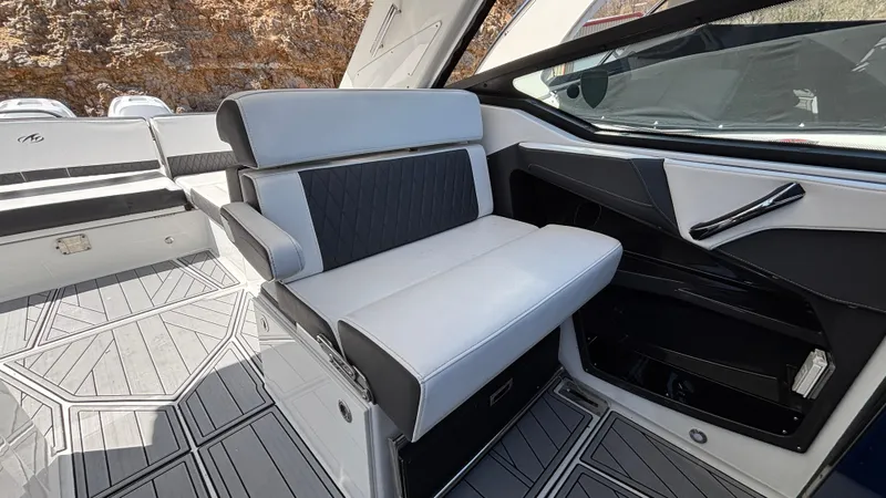 Slide: The Image of 2023 Monterey 385SS boat interior with sleek seating and modern design. - 14