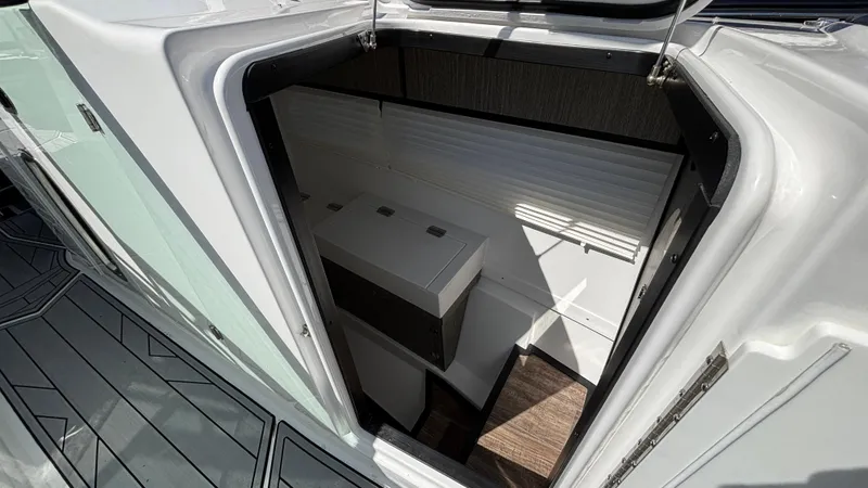 Slide: The Image of 2023 Monterey 385SS boat interior storage compartment with sleek design and modern finishes. - 19