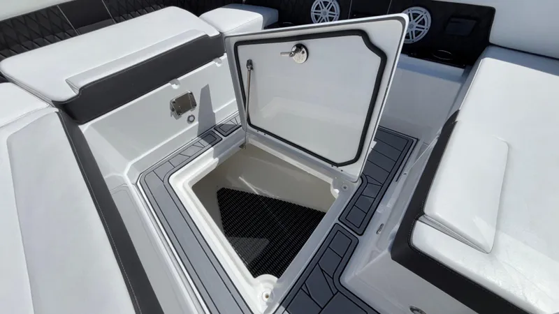 Slide: The Image of 2023 Monterey 385SS boat storage compartment with open hatch, showcasing sleek design and functionality. - 26