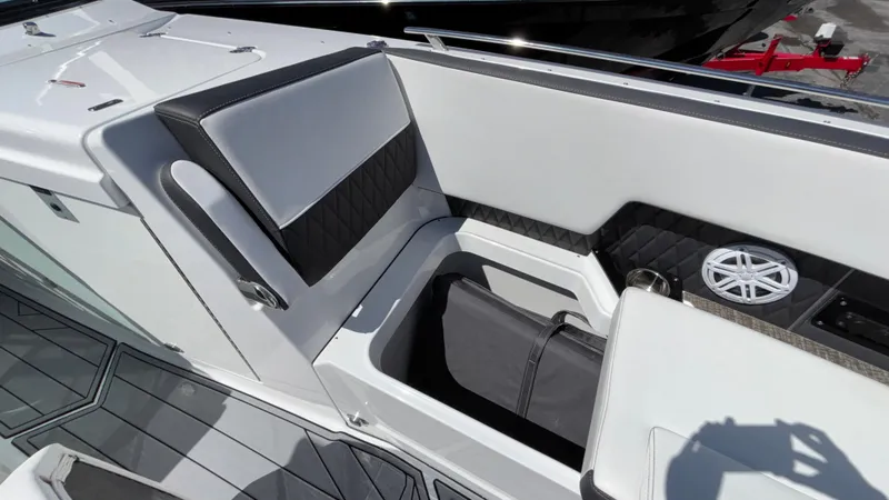 Slide: The Image of 2023 Monterey 385SS boat interior with sleek seating and modern speaker system. - 29