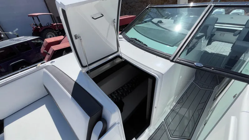 Slide: The Image of 2023 Monterey 385SS boat with open storage compartment and sleek interior design. - 30