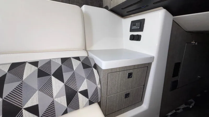 Slide: The Image of 2023 Monterey 385SS interior with geometric-patterned upholstery and modern control panel. - 34