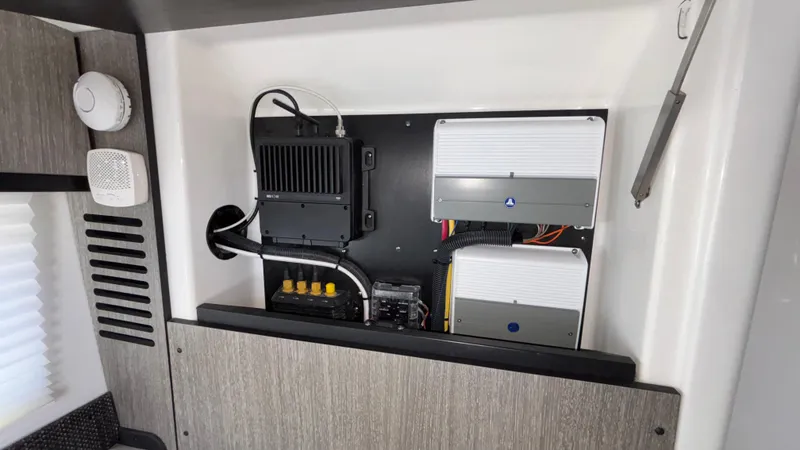 Slide: The Image of Electrical panel inside 2023 Monterey 385SS boat, featuring wiring and components. - 35