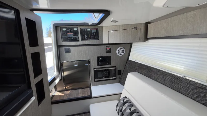 Slide: The Image of 2023 Monterey 385SS boat interior with modern amenities and sleek design. - 36