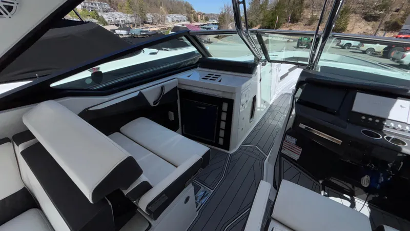 Slide: The Image of 2023 Monterey 385SS boat interior with modern dashboard and seating. - 44