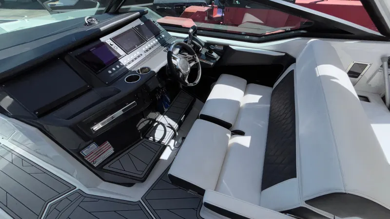 Slide: The Image of 2023 Monterey 385SS boat interior with modern dashboard and white seating. - 49