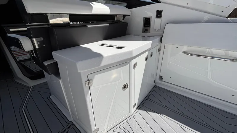 Slide: The Image of 2023 Monterey 385SS boat interior with sleek cabinetry and modern design. - 8
