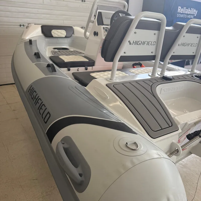 Slide: The Image of 2025 Highfield Sport 330 boat interior with quilted seating and modern design. - 10