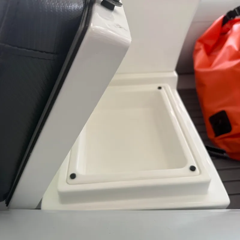 Slide: The Image of 2025 Highfield Sport 330 boat interior with cushioned seating and storage compartment. - 5