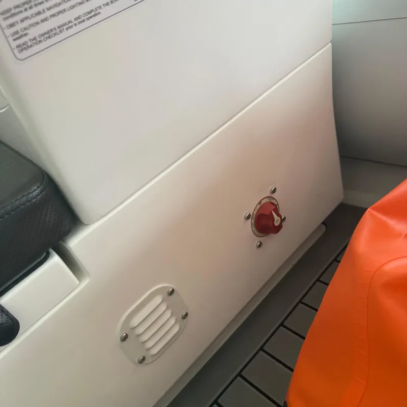 Slide: The Image of 2025 Highfield Sport 330 boat steering wheel and control panel close-up. - 8