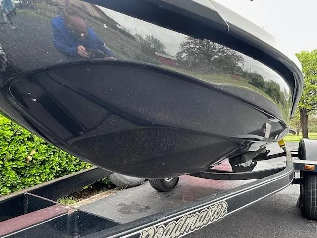 Slide: The Image of 2011 Sea-Doo RXT 260 on trailer, black hull, outdoor setting. - 12