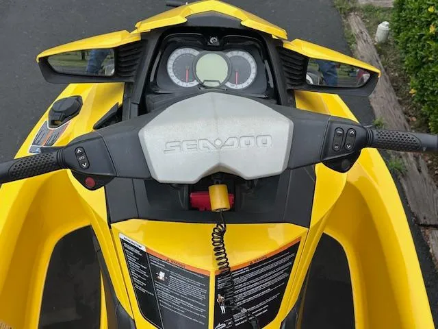 Slide: The Image of 2011 Sea-Doo RXT 260 dashboard with yellow body and control panel. - 9