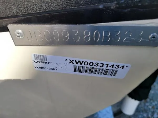 Slide: The Image of 2023 Xpress X21 Pro boat identification plate with serial number and barcode. - 12
