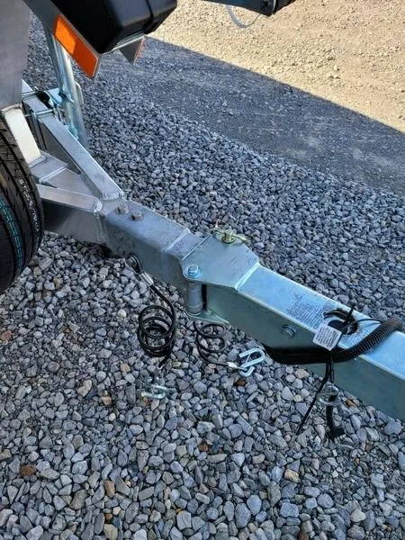 Slide: The Image of Trailer hitch of 2023 Xpress X21 Pro on gravel surface. - 5