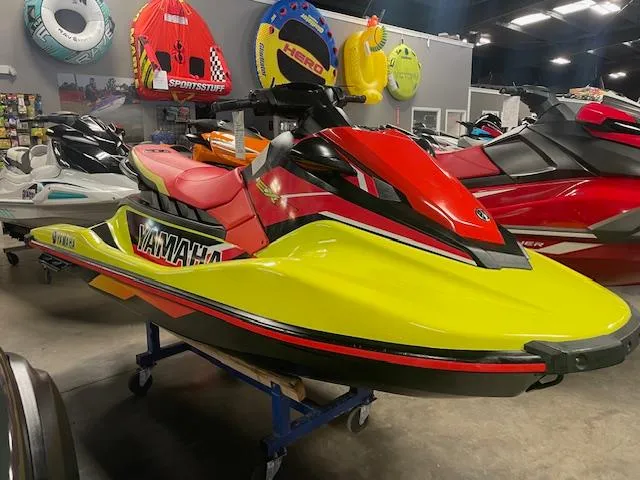 Slide: The Image of 2021 Yamaha WaveRunner EXR in vibrant red and yellow on display in showroom. - 5