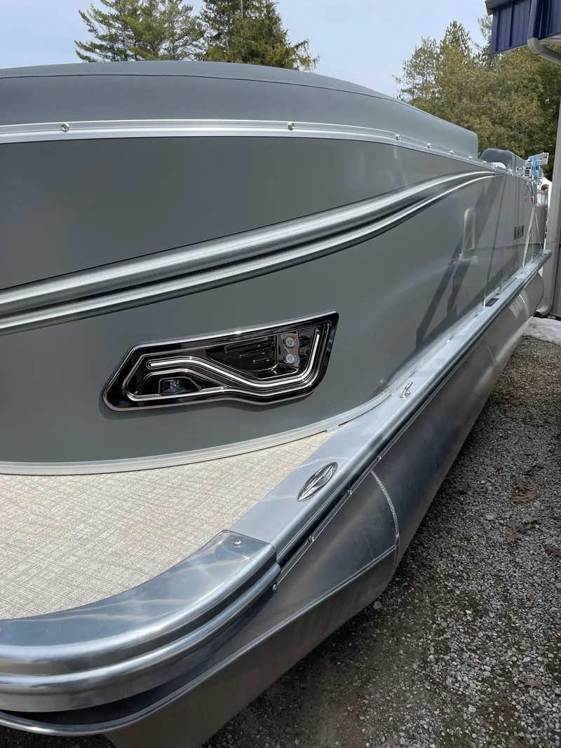 Slide: The Image of 2025 Avalon 23 LSZ Elite pontoon boat, sleek gray exterior, modern design. - 1