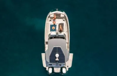 Slide: The Image of Overhead view of 2025 YOT 36 boat with people relaxing on deck. - 3