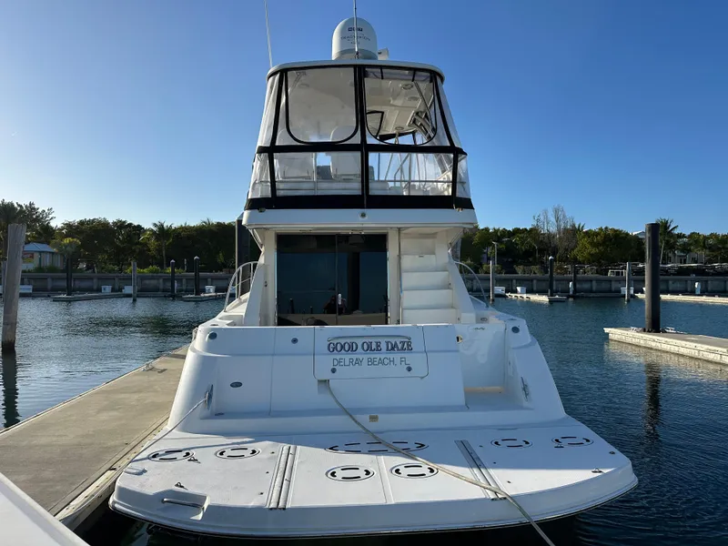 Slide: The Image of 2008 Sea Ray 47 Sedan Bridge yacht docked at marina, rear view. - 12