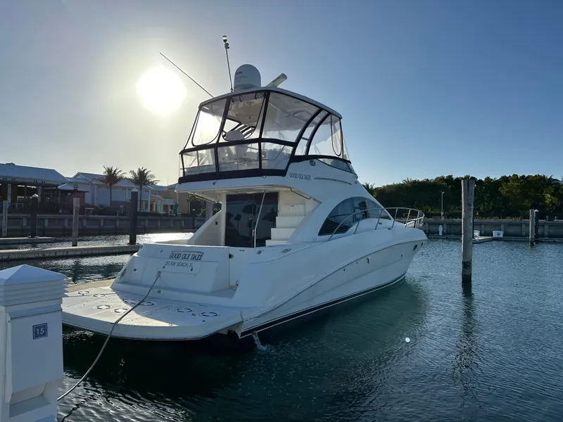 Slide: The Image of 2008 Sea Ray 47 Sedan Bridge yacht docked at marina during sunset. - 13