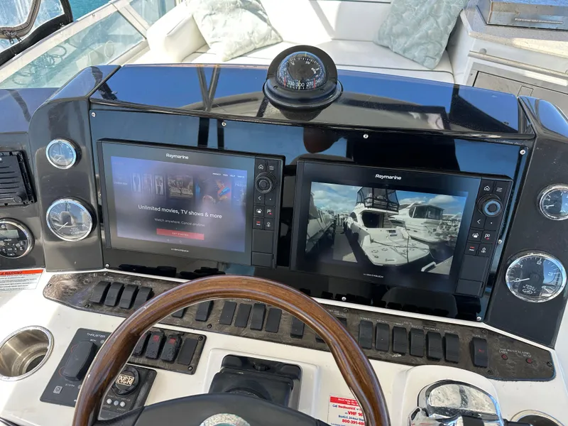 Slide: The Image of Helm of 2008 Sea Ray 47 Sedan Bridge with dual Raymarine displays. - 18