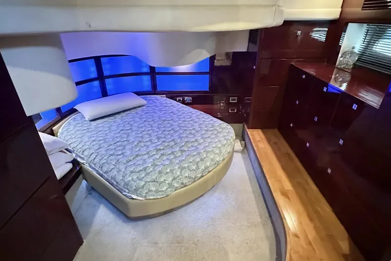 Slide: The Image of Luxurious bedroom interior of 2008 Sea Ray 47 Sedan Bridge yacht with ambient lighting. - 28