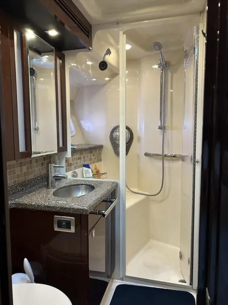 Slide: The Image of Luxurious bathroom in 2008 Sea Ray 47 Sedan Bridge yacht with modern fixtures and shower. - 31