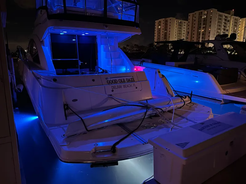 Slide: The Image of 2008 Sea Ray 47 Sedan Bridge yacht docked at night with blue LED lights. - 40