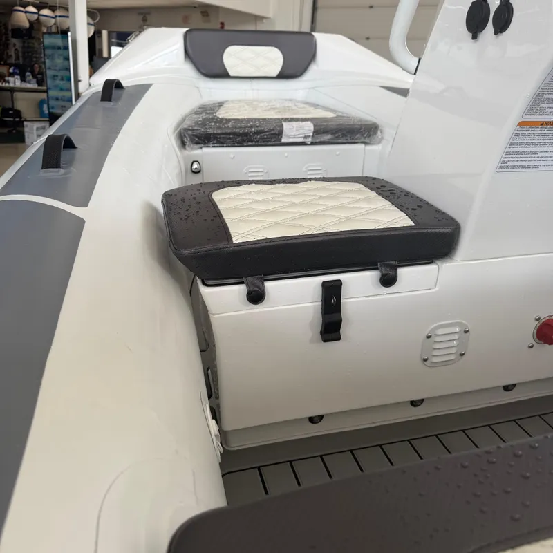 Slide: The Image of Interior view of 2025 Highfield Sport 360 boat, featuring a red switch and non-slip flooring. - 7