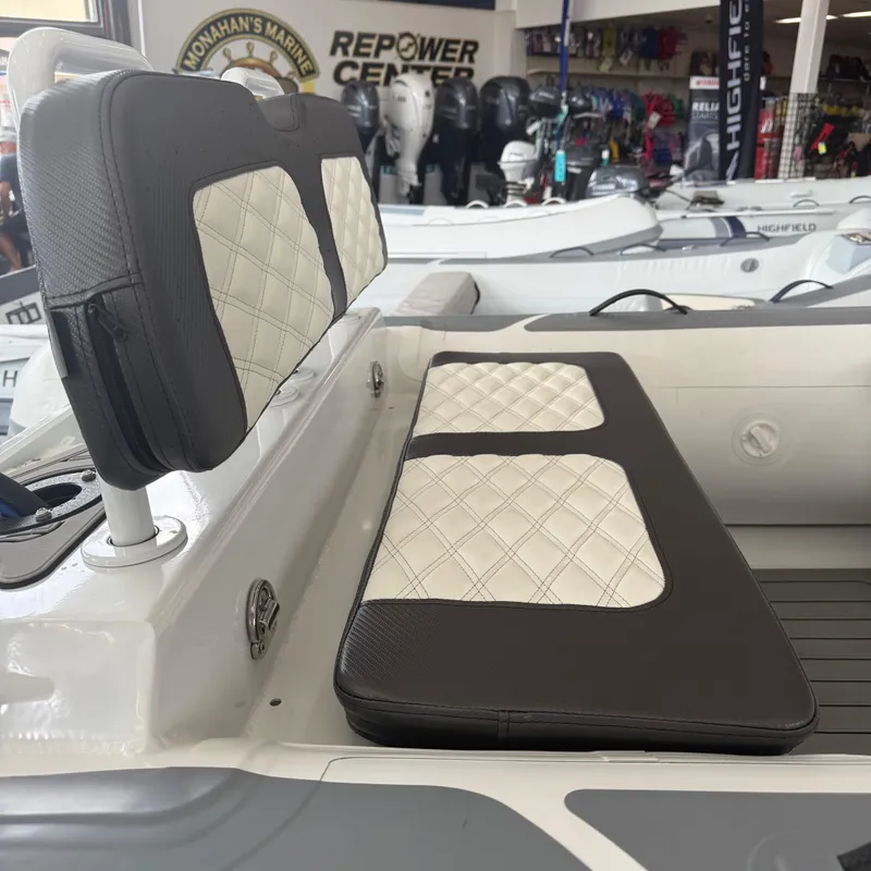 Slide: The Image of 2025 Highfield Sport 360 boat interior storage compartment with open lid. - 9