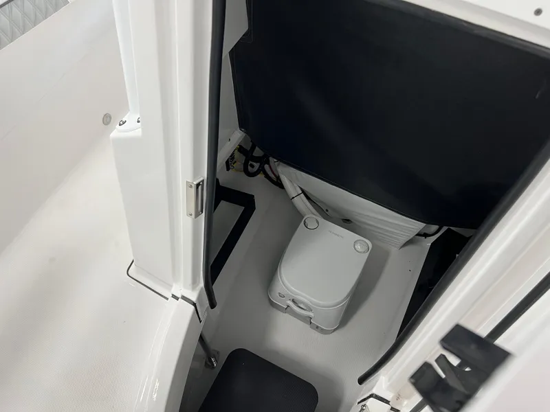 Slide: The Image of Portable toilet inside 2025 Blackfin 222CC boat cabin. - 26