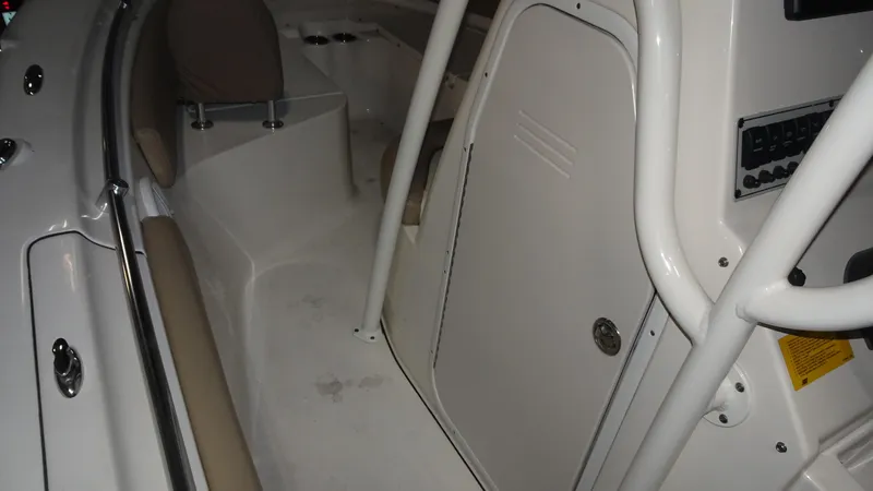 Slide: The Image of Interior view of a 2015 Key West 219 FS boat, featuring seating and storage areas. - 10