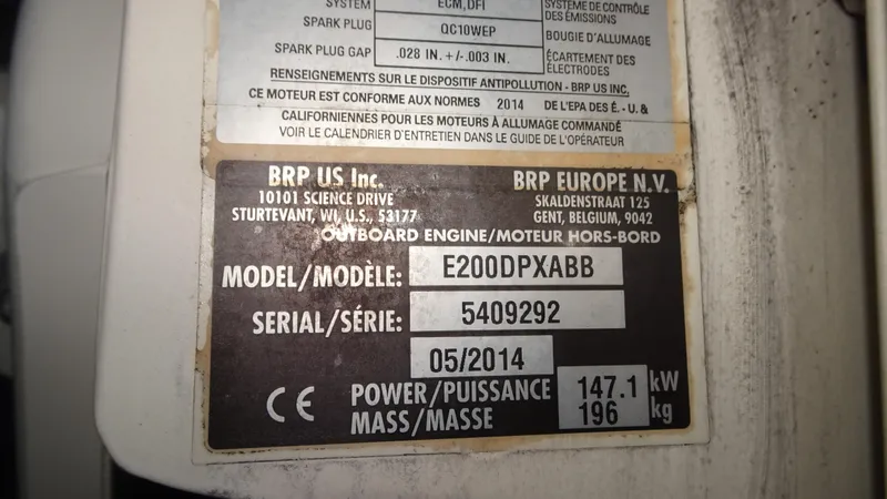 Slide: The Image of Label on outboard engine showing model E200DPXABB, serial 5409292, power 147.1 kW. - 27