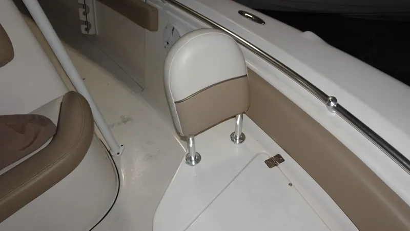 Slide: The Image of 2015 Key West 219 FS boat interior with beige and white seating. - 7