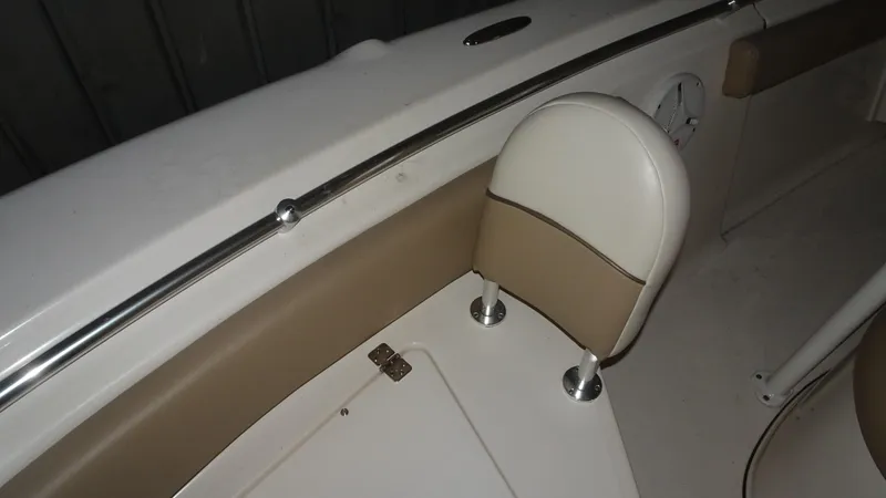 Slide: The Image of Interior of 2015 Key West 219 FS boat with beige and white seating. - 8