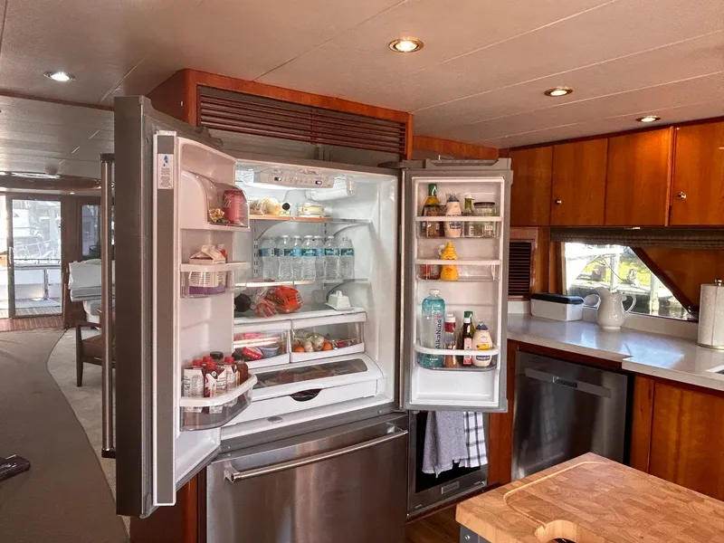 Slide: The Image of Open refrigerator in 2003 Hargrave Sky Lounge yacht kitchen, stocked with food and drinks. - 19