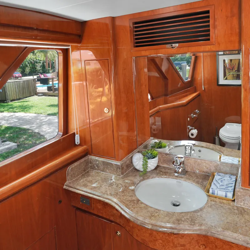 Slide: The Image of Luxurious bathroom interior on 2003 Hargrave Sky Lounge yacht with wood finish and marble countertop. - 24