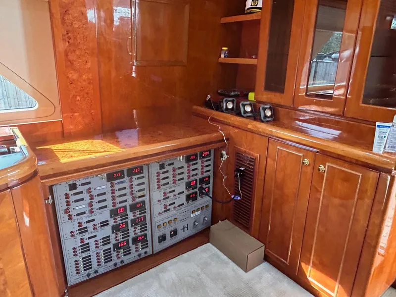 Slide: The Image of Control panel in 2003 Hargrave Sky Lounge yacht with polished wood cabinetry. - 31