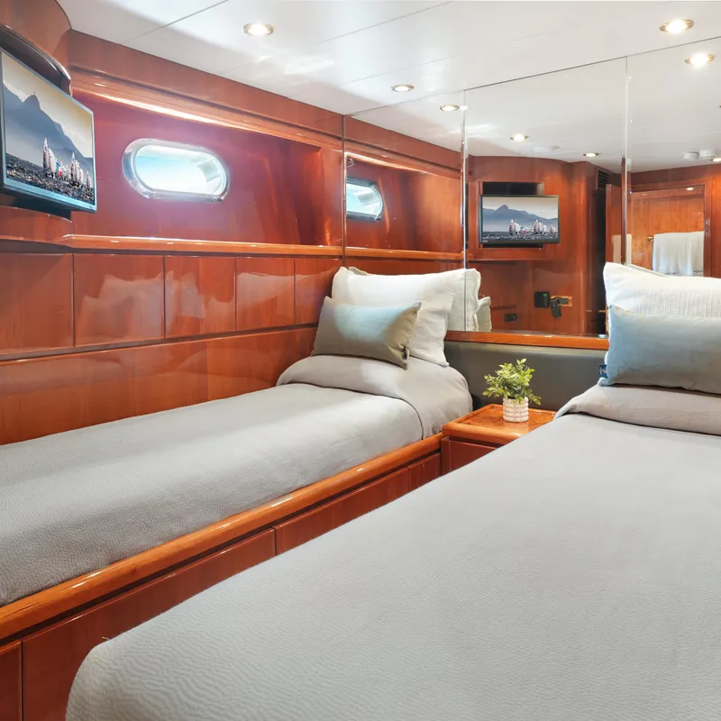 Slide: The Image of Luxurious 2003 Hargrave Sky Lounge yacht cabin with twin beds and elegant wood paneling. - 40