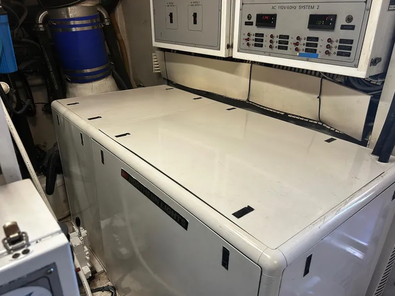 Slide: The Image of Engine room of 2003 Hargrave Sky Lounge yacht with control panels and equipment. - 58