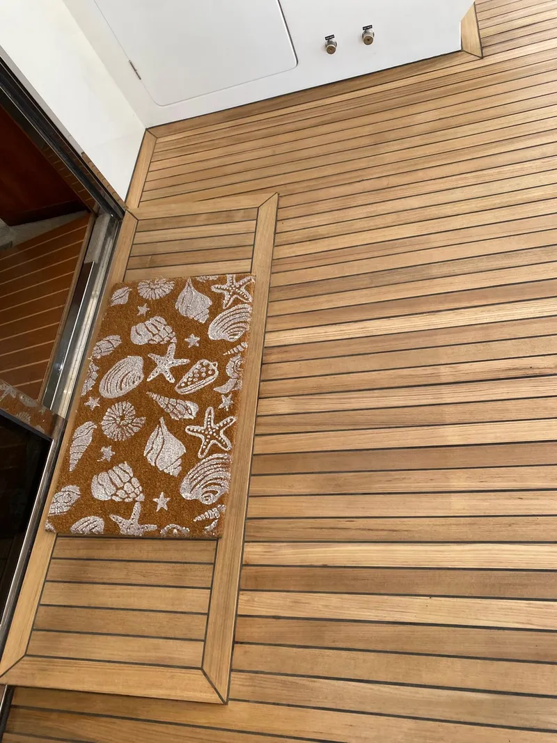 Slide: The Image of Teak deck with seashell-patterned mat on 2003 Hargrave Sky Lounge yacht. - 7